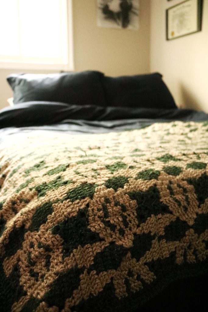 mosaic crochet blanket on bed